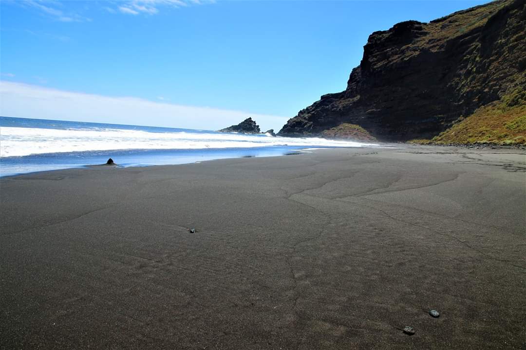 Tenerife’s volcanic beaches are among the most dramatic in the Canary Islands Black volcanic sand beach in Tenerife with rugged cliffs