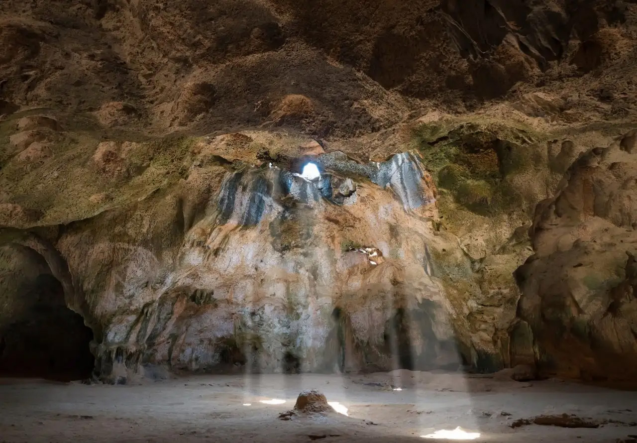 Guadirikiri Cave – Sunlit Chamber in Arikok National Park Light beams entering Guadirikiri Cave inside Arikok National Park, Aruba