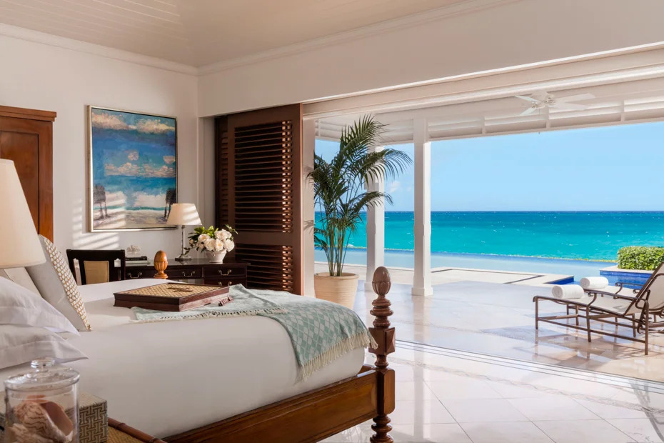 Bahamas Accommodation – Luxury Oceanfront Rooms & Places to Stay Luxury oceanfront hotel room in the Bahamas with open terrace, lounge chairs and turquoise sea view