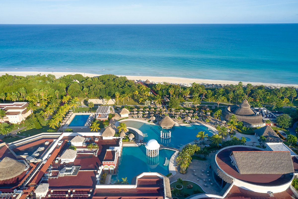 Cuba Hotels – Best Beach Resorts and Places to Stay in Varadero and Beyond Aerial view of an all-inclusive beachfront resort in Varadero, Cuba with white-sand beach and turquoise Caribbean Sea