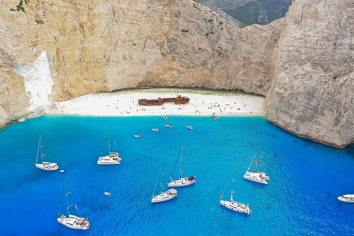 Beaches in Greece – Iconic Turquoise Coastlines and Dramatic Cliffs Turquoise waters and dramatic cliffs at Navagio Beach, one of the most famous beaches in Greece