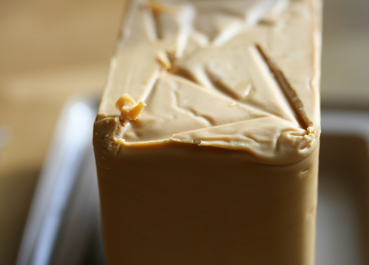 Brunost – Brown cheese: a close view of Norway’s caramel-coloured whey cheese. Brunost – Brown cheese: a close view of Norway’s caramel-coloured whey cheese.