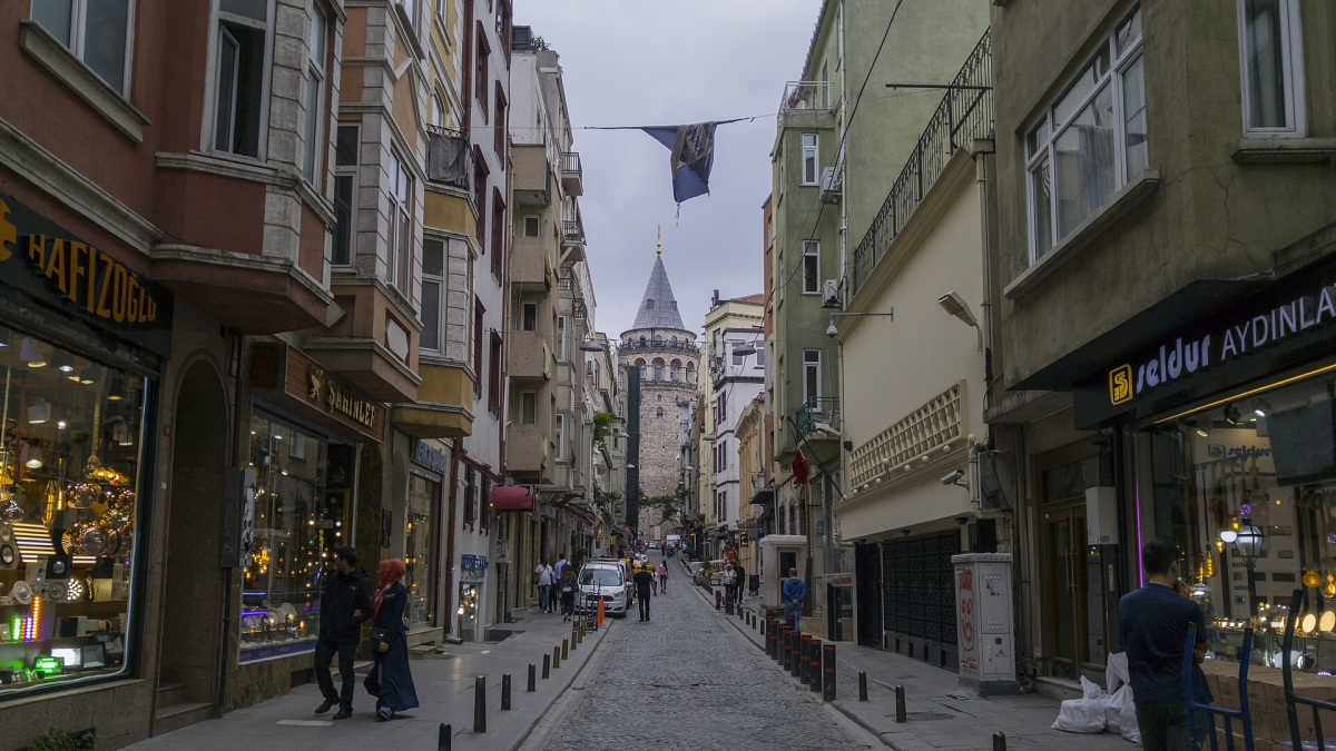 Galata Tower at the end of a street lined with shops in Istanbul Galata Tower at the end of a street lined with shops in Istanbul