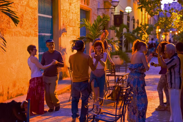 Tourists walking safely in Old Havana at night