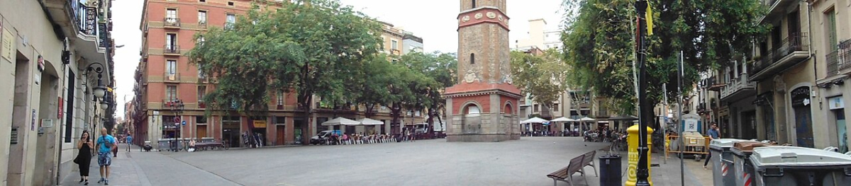 Panoramic view of Plaça de la Vila de Gràcia and its clock tower Panoramic view of Plaça de la Vila de Gràcia and its clock tower