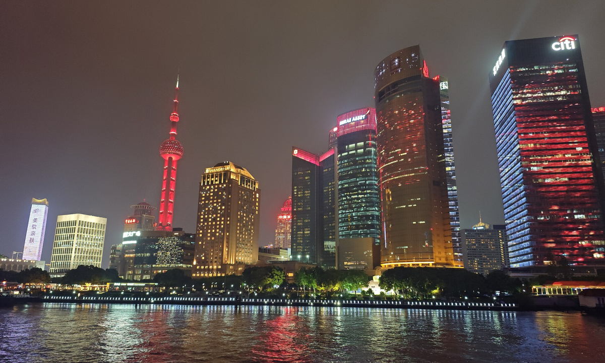 Pudong skyline across the Huangpu River at night Pudong skyline across the Huangpu River at night