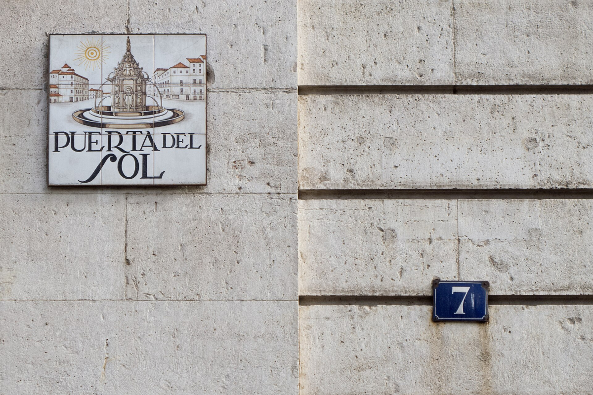 A Puerta del Sol street sign. A Puerta del Sol street sign.