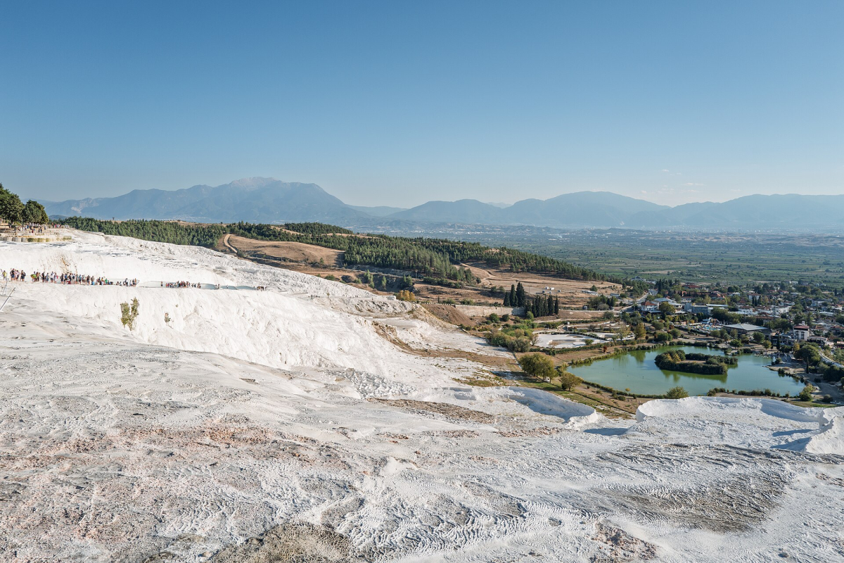 White travertine terraces at Pamukkale overlooking the valley below White travertine terraces at Pamukkale overlooking the valley below