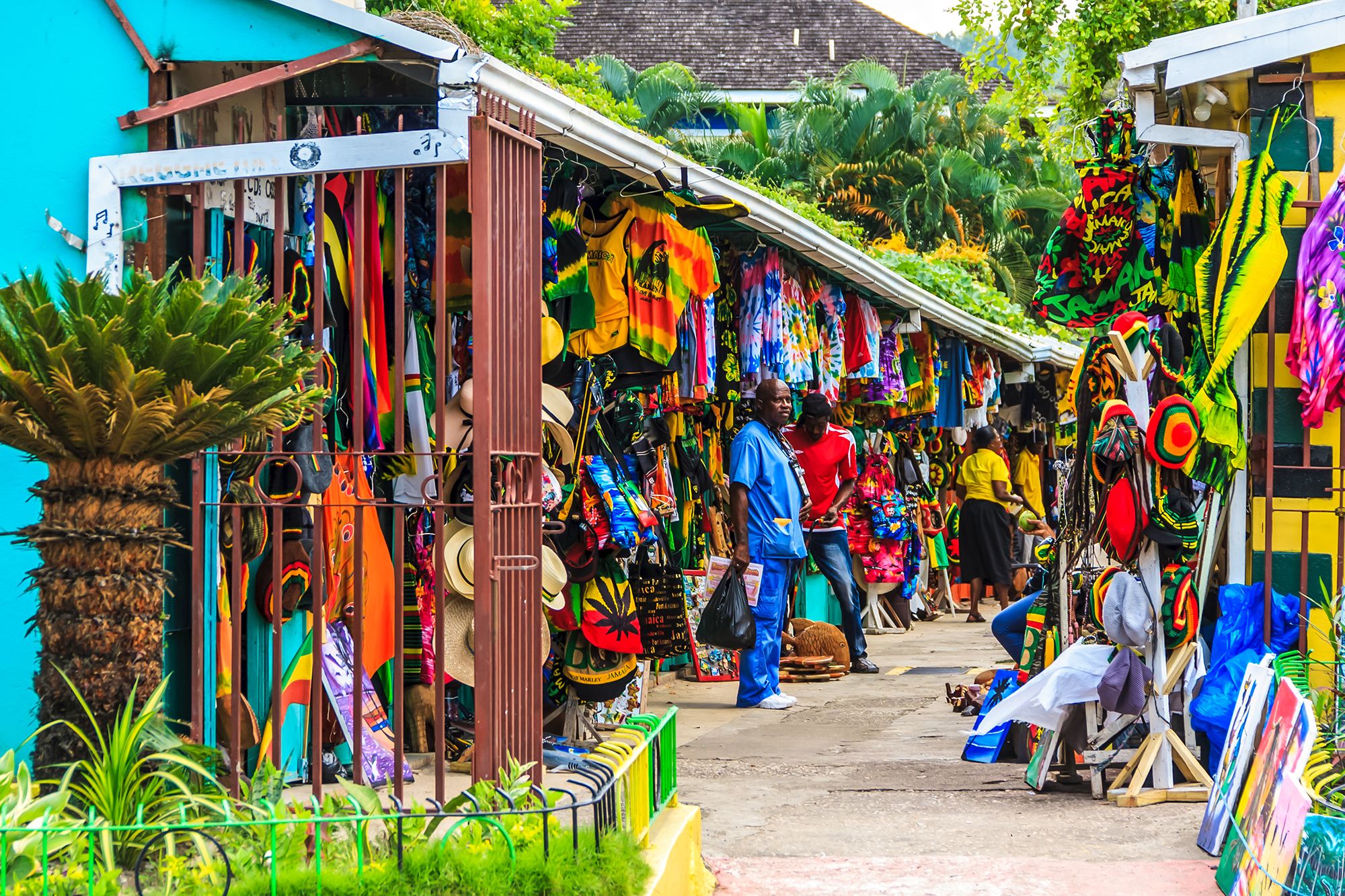Shopping in Jamaica – Local Markets, Crafts & Souvenirs Colorful street market in Jamaica with local vendors selling handmade crafts, souvenirs and clothing