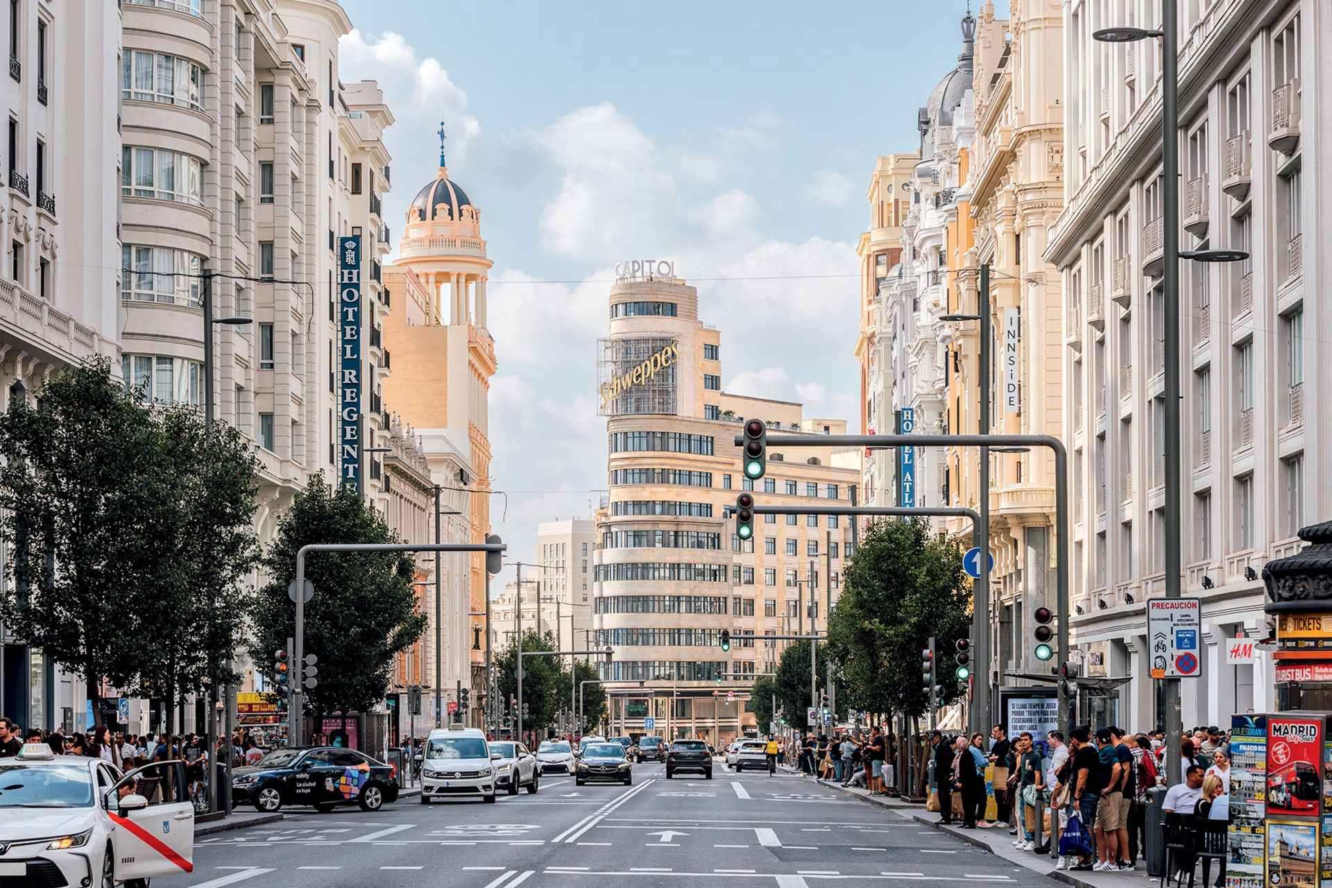 Where to Stay in Madrid – Best Areas and Neighborhoods Central Madrid skyline with hotels and apartment buildings around a busy roundabout
