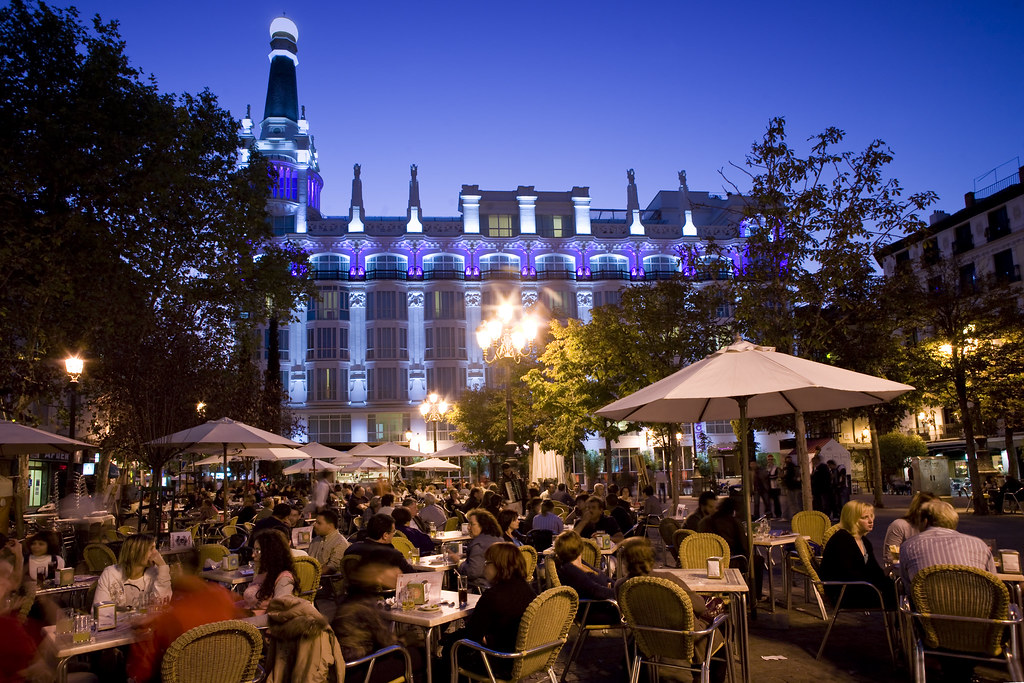 Madrid Nightlife Guide Nightlife in Madrid’s Plaza de Santa Ana with terraces, people and illuminated historic building