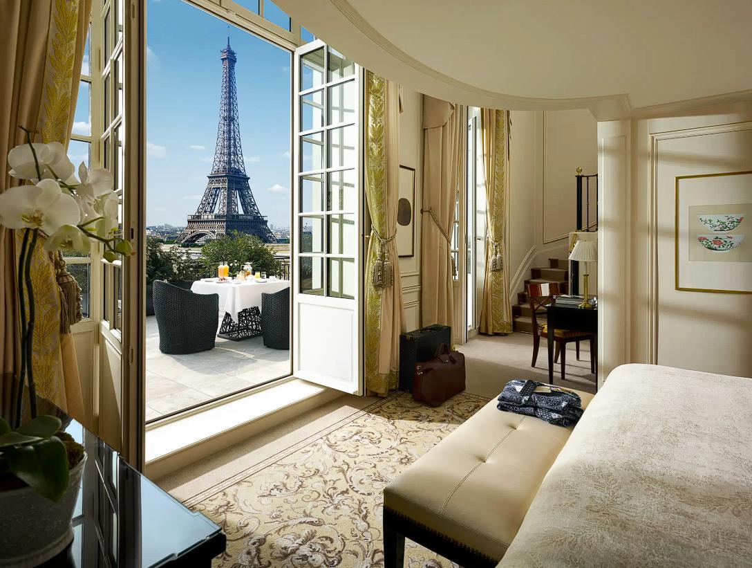 Best Hotels in Paris Luxury hotel room in Paris with Eiffel Tower view from a private balcony